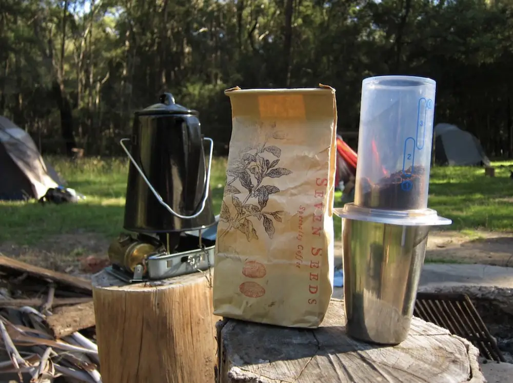 Making coffee over a fire at camping trip